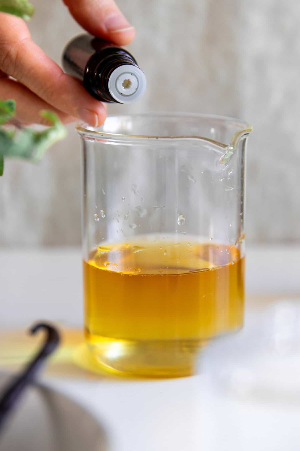Add essential oils to vanilla extract mixture